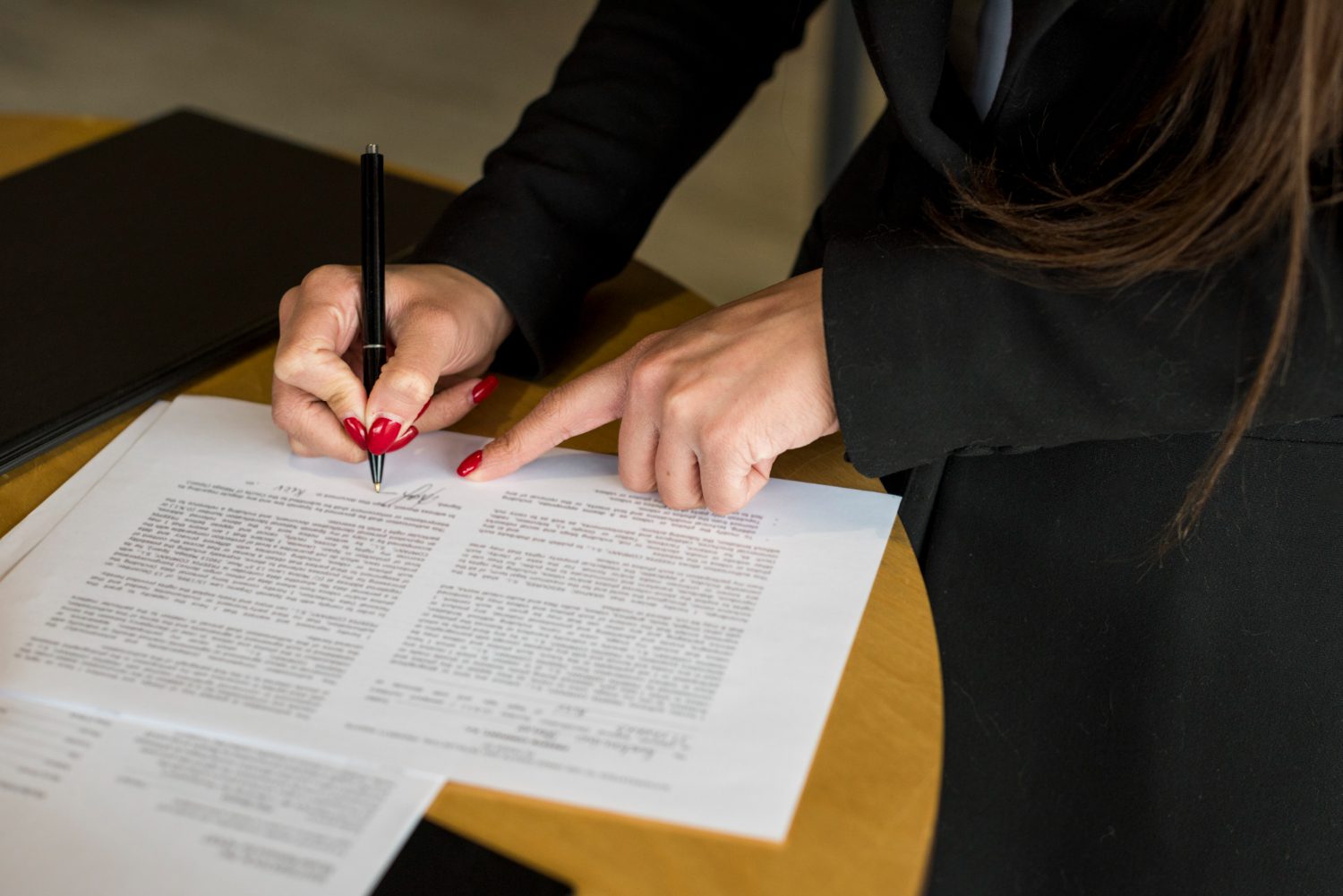 brunette-businesswoman-writing-document